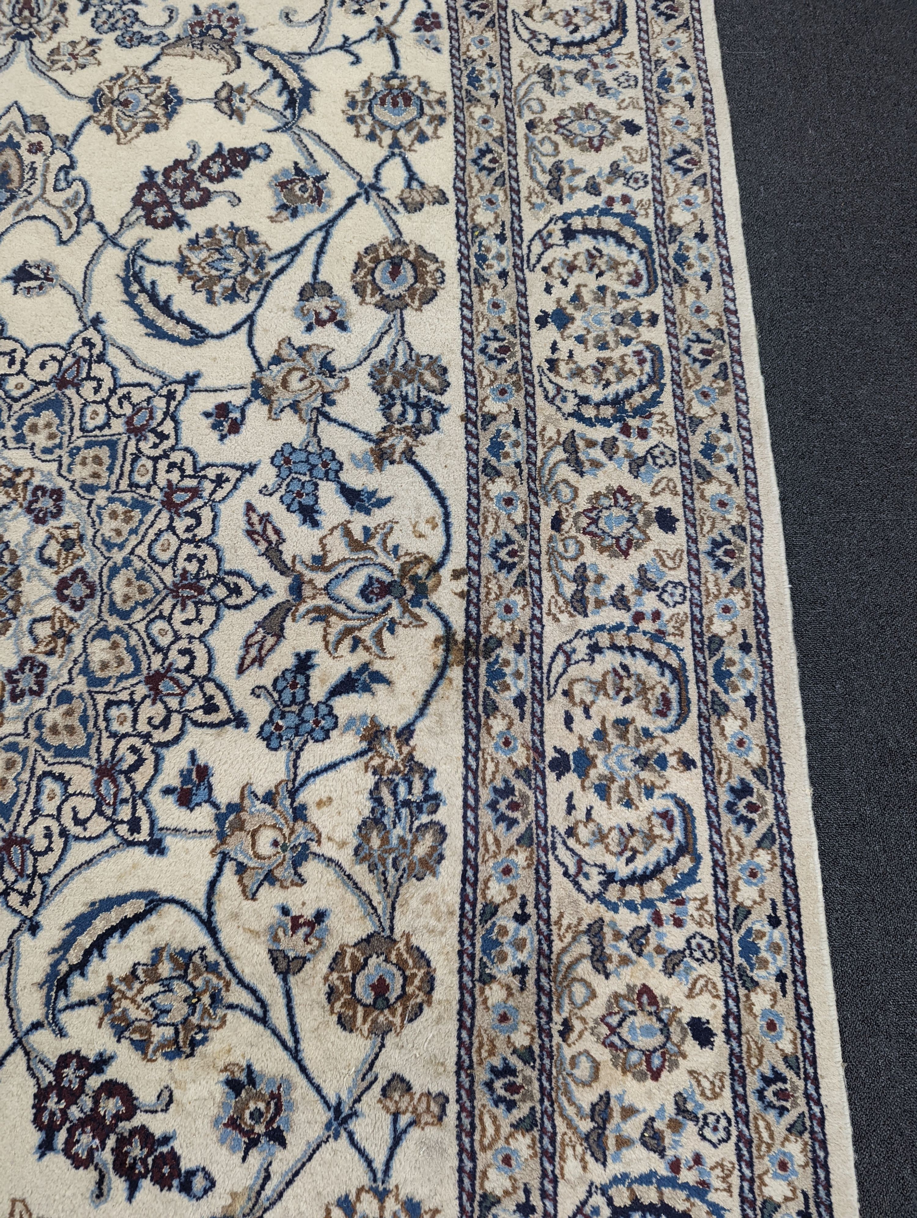 An ivory ground Nain carpet, 290 x 205cm